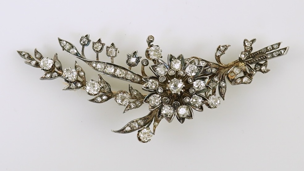 A Victorian gold, silver and diamond cluster foliate spray brooch